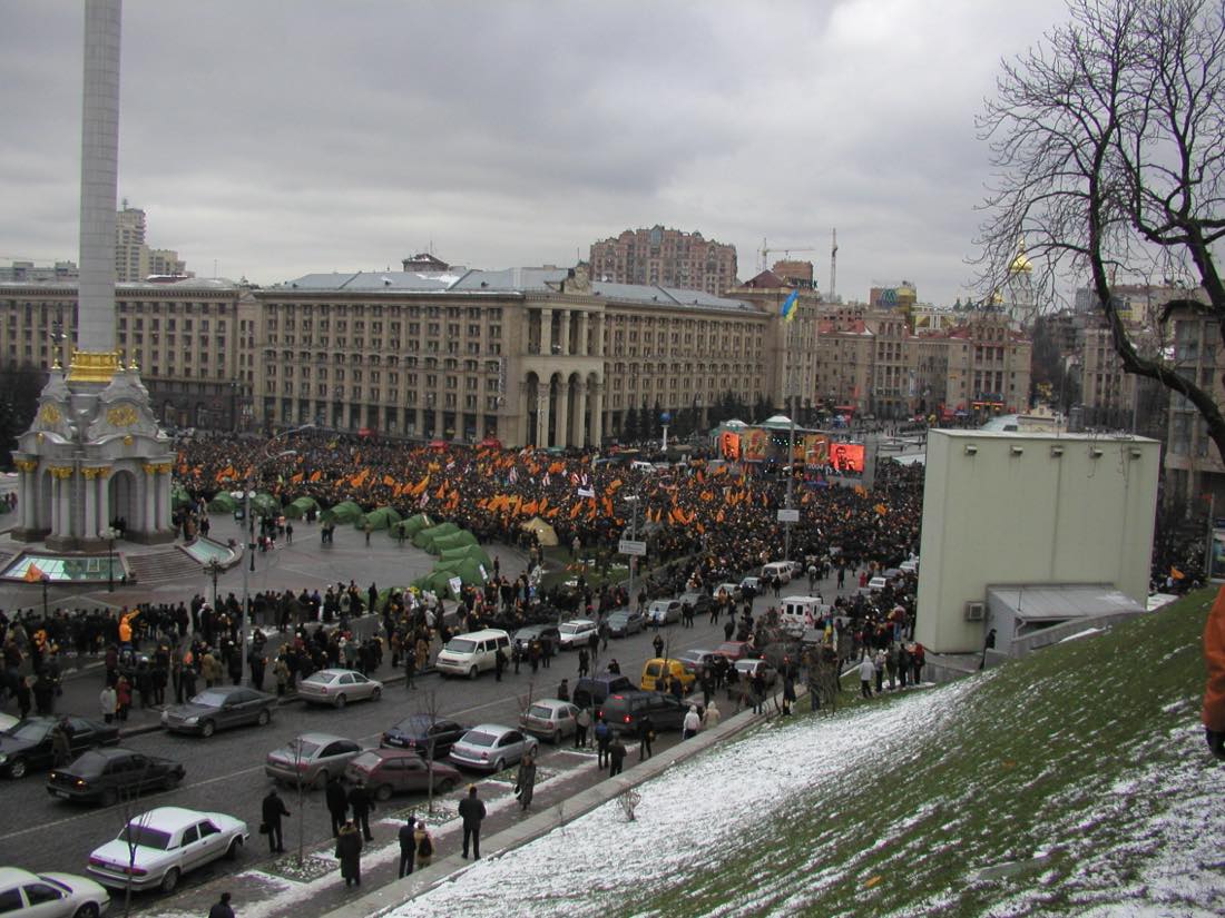Crowds with orange flags fill Kyiv's Independence Square during the Orange Revolution, November 2004